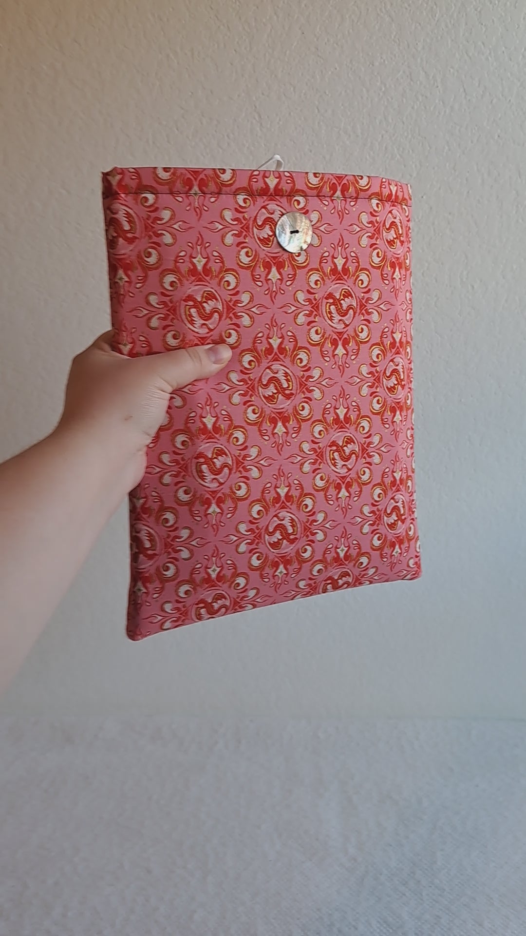 video of the Rose dragon booksleeve with a book in it